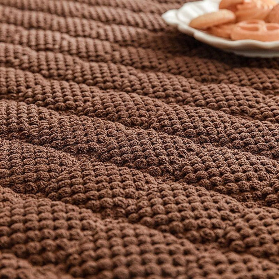 Textured sofa cover fitted on a couch