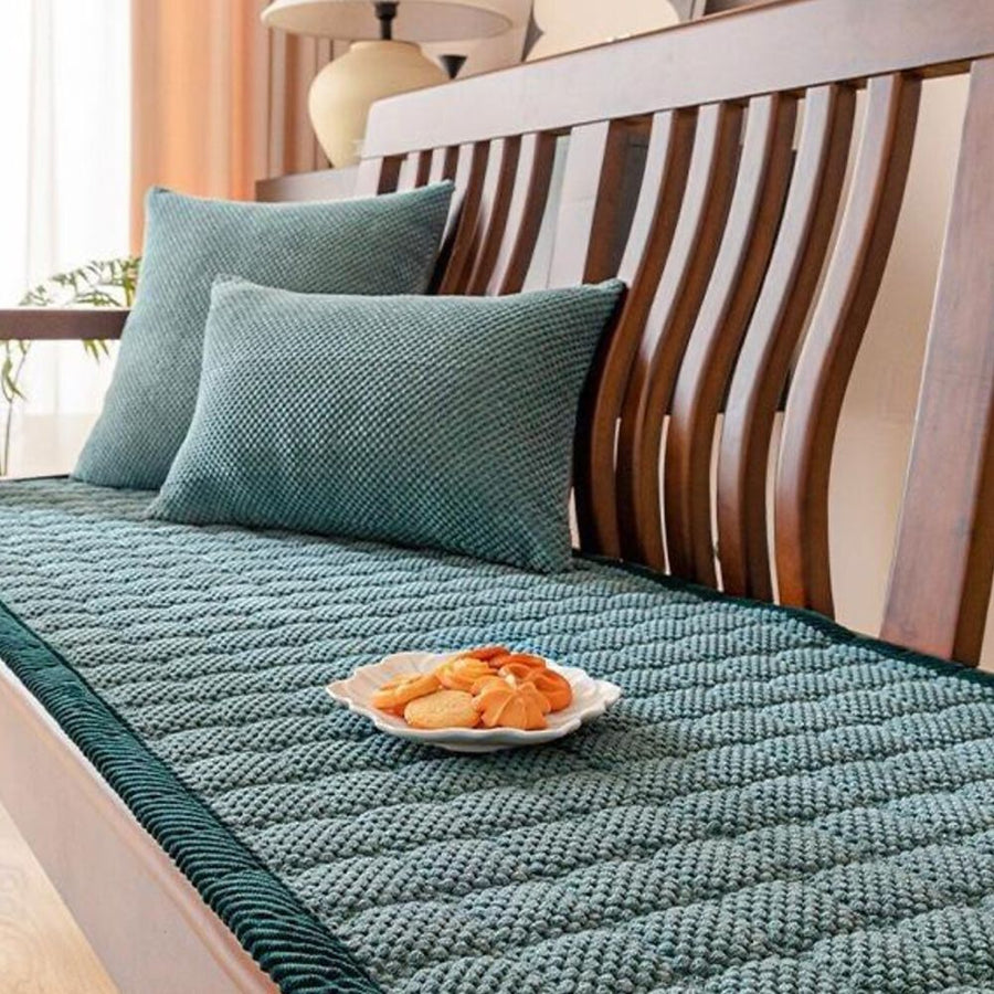Textured sofa cover draped over a sofa