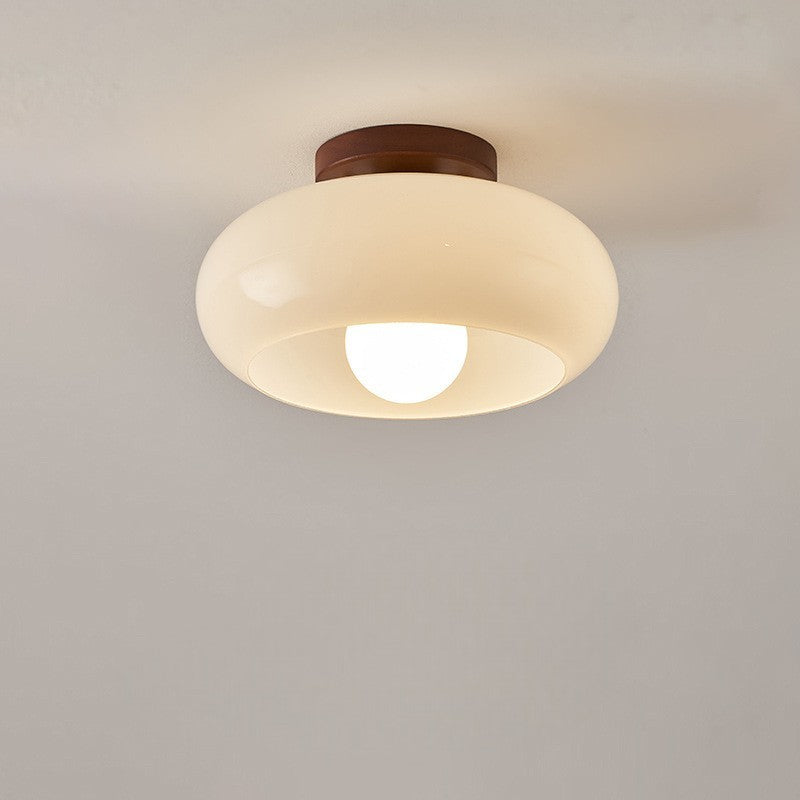 Modern industrial LED ceiling lamp lit in a room