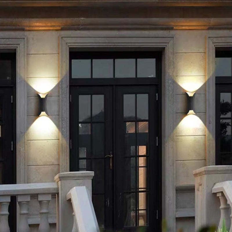 Outdoor wall light mounted beside a doorway
