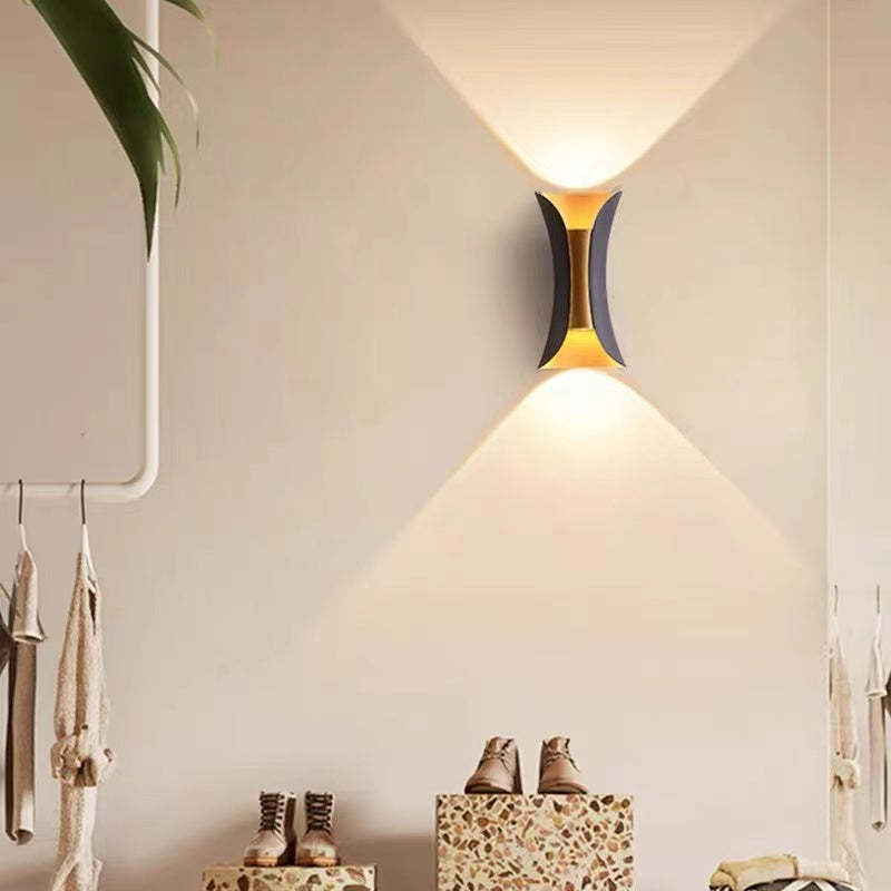 Wall light shown in black finish on an exterior wall