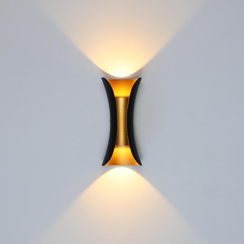 Outdoor wall light illuminated at night on a patio
