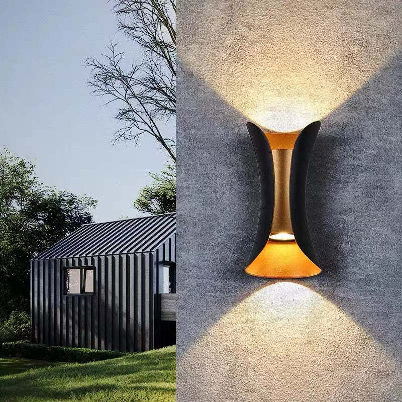 Detail of the wall light's curved metal housing