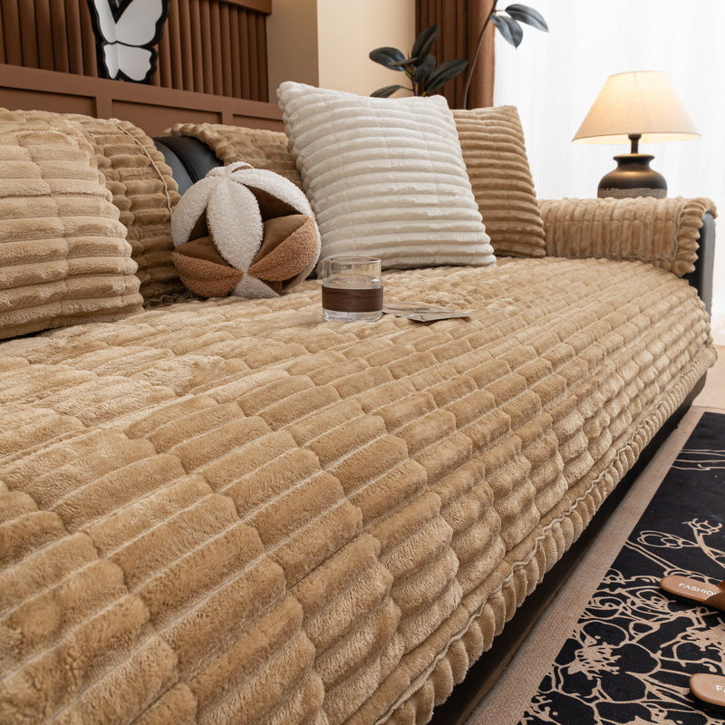 Beige quilted corduroy sofa cushion on a gray couch