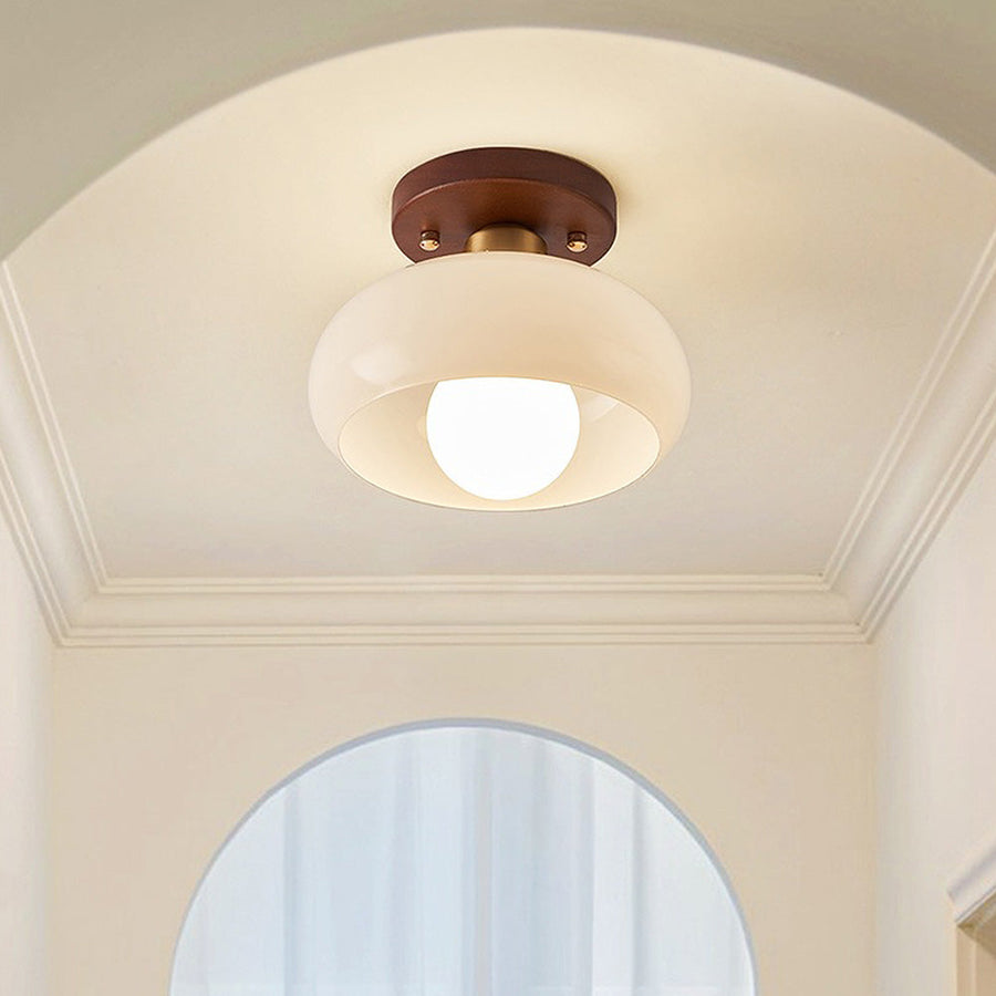 Ceiling lamp mounted above a hallway console table