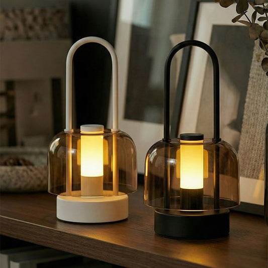 Dimmable bedside lamp glowing softly on a nightstand