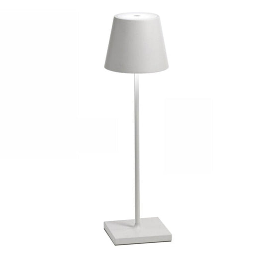 Minimalist rechargeable table lamp with touch dimmer on a nightstand