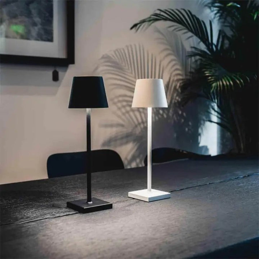 Minimalist table lamp placed on a bedside table at night