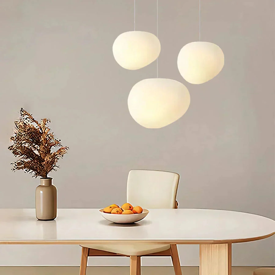 Pebble pendant light illuminated in a living room