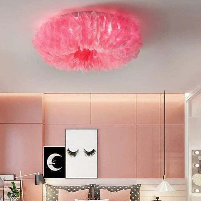 Boho LED ceiling lamp with feathers shown in warm white light