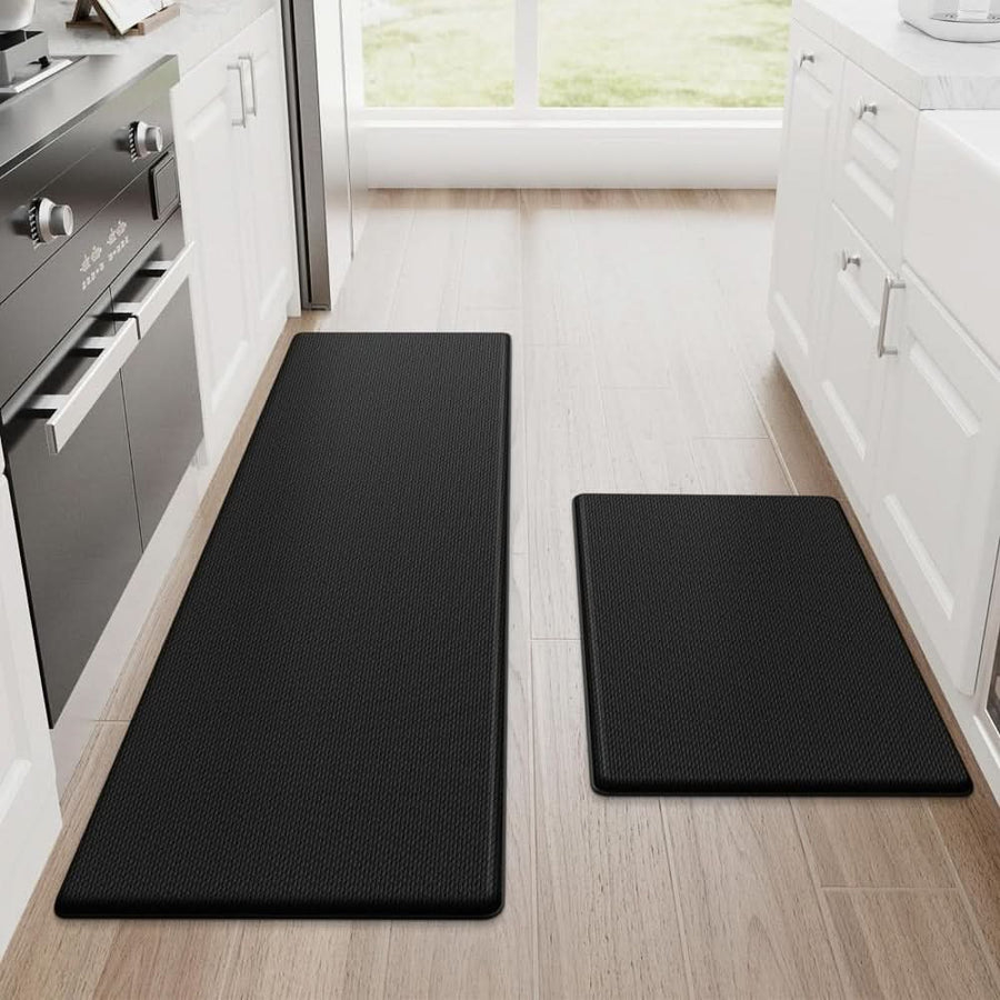 Kitchen mat in red laid out on the floor.