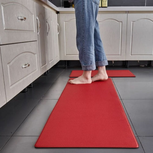 Padded kitchen mat with a water-resistant surface displayed in a kitchen.