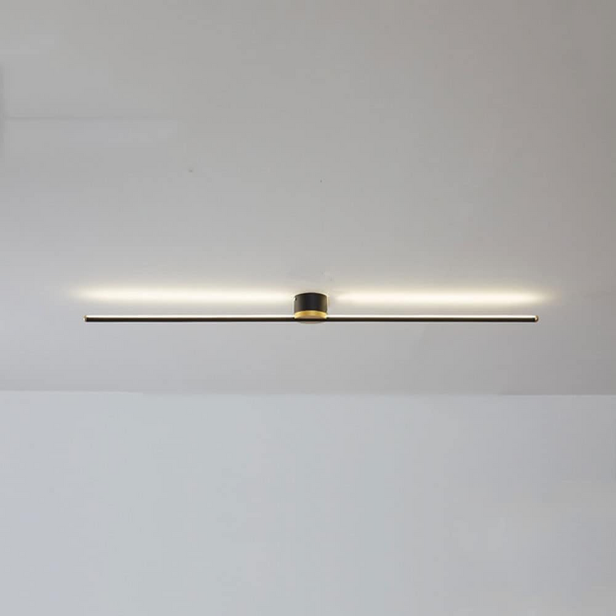 White linear LED semi-flush ceiling light installed above a bed