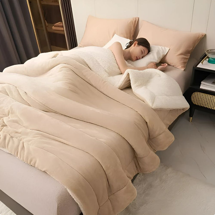 Reversible warm throw blanket draped over a sofa