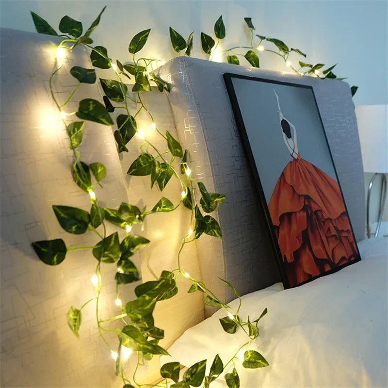 Ivy vine string lights wrapped around a tree