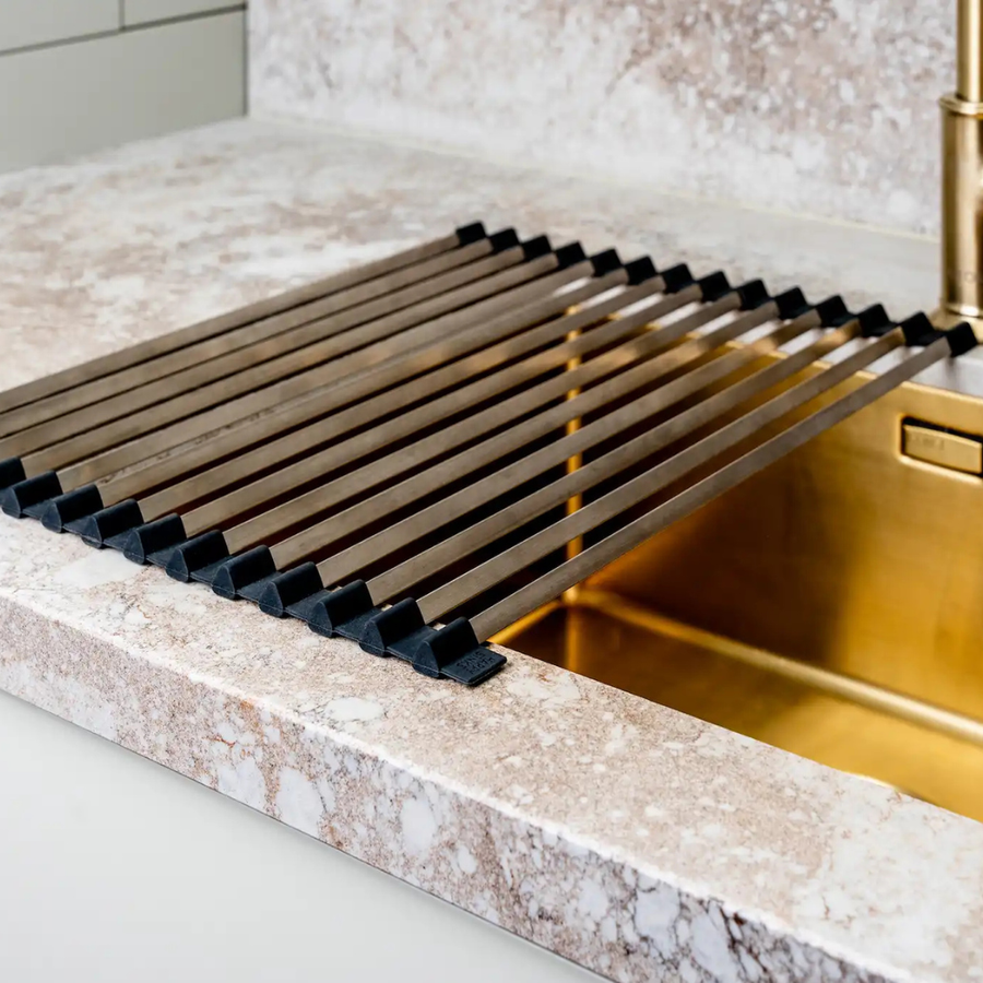 Dish rack rolled out on a countertop next to the sink.