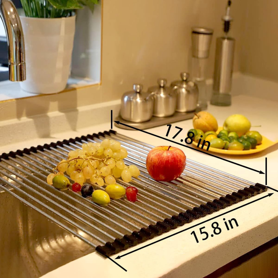Dish rack fully extended with dishes drying above the sink.
