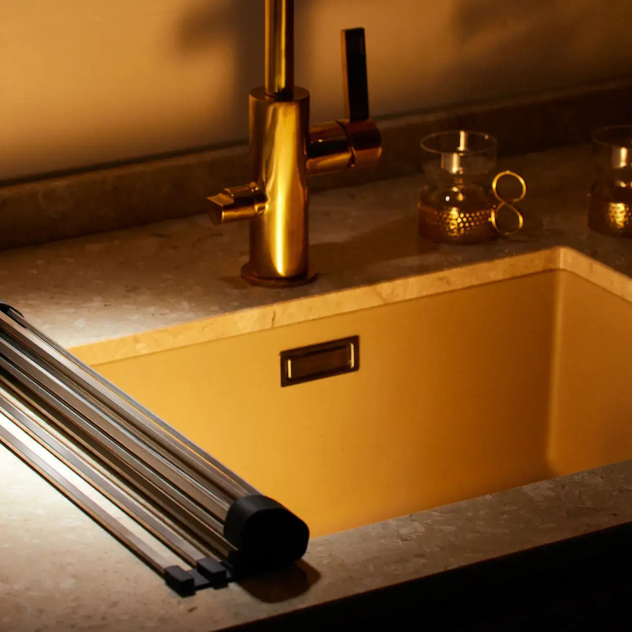 Close-up of the dish rack's rods holding a plate.