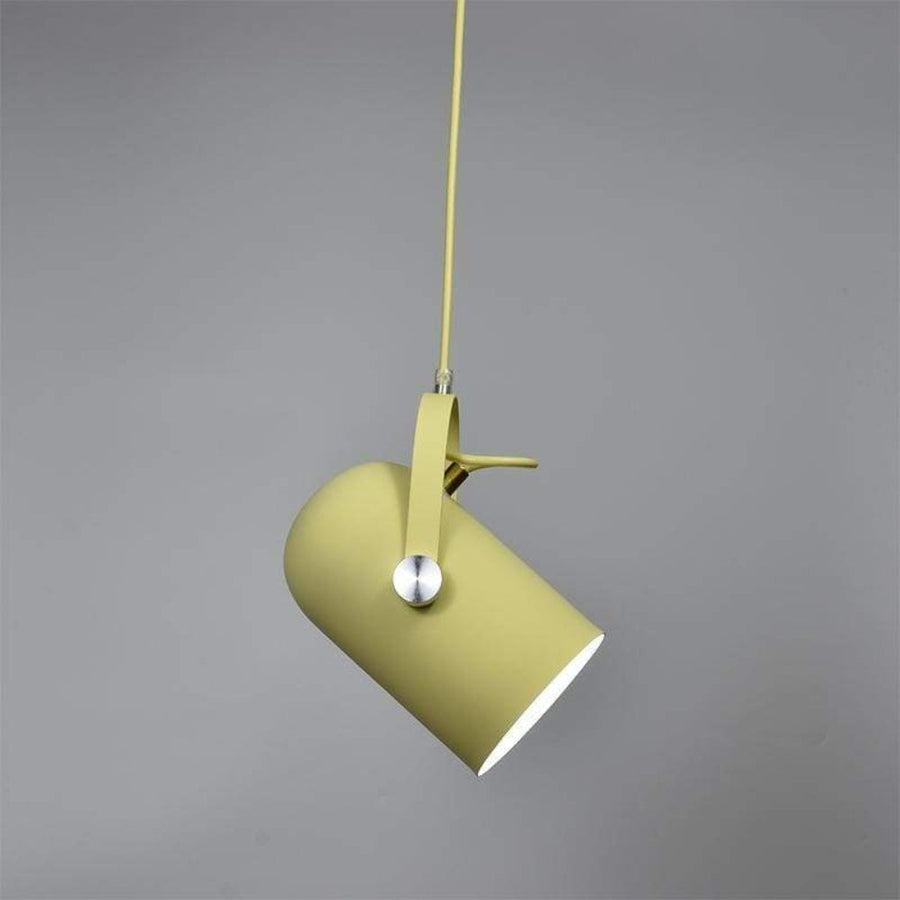 Pendant lamp glowing with warm light in a dim room