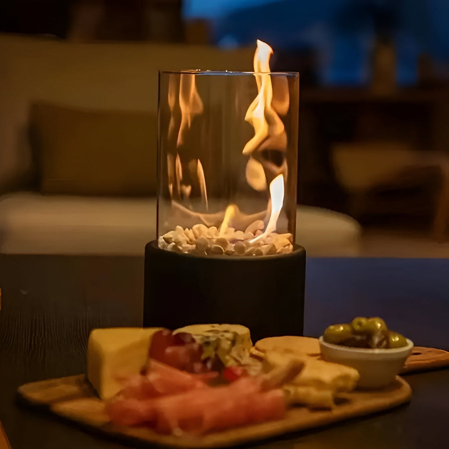 Round smokeless tabletop fire pit on a side table
