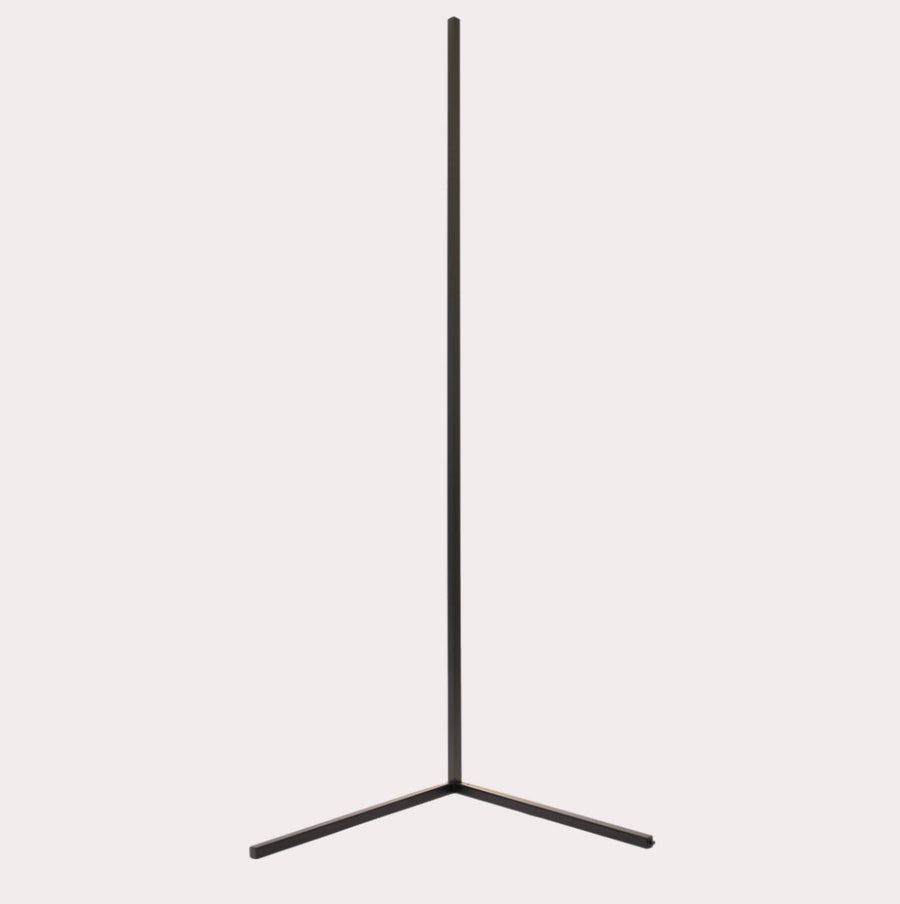 Corner floor lamp casting a warm glow at night