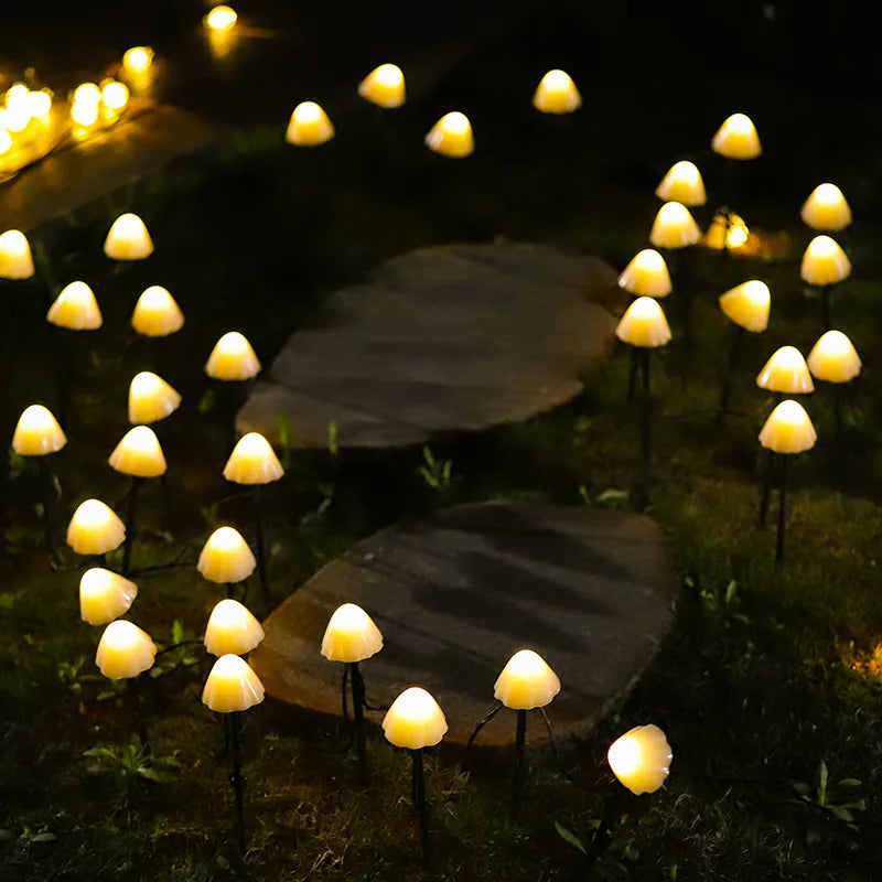 Mushroom-shaped solar lights lining a garden path