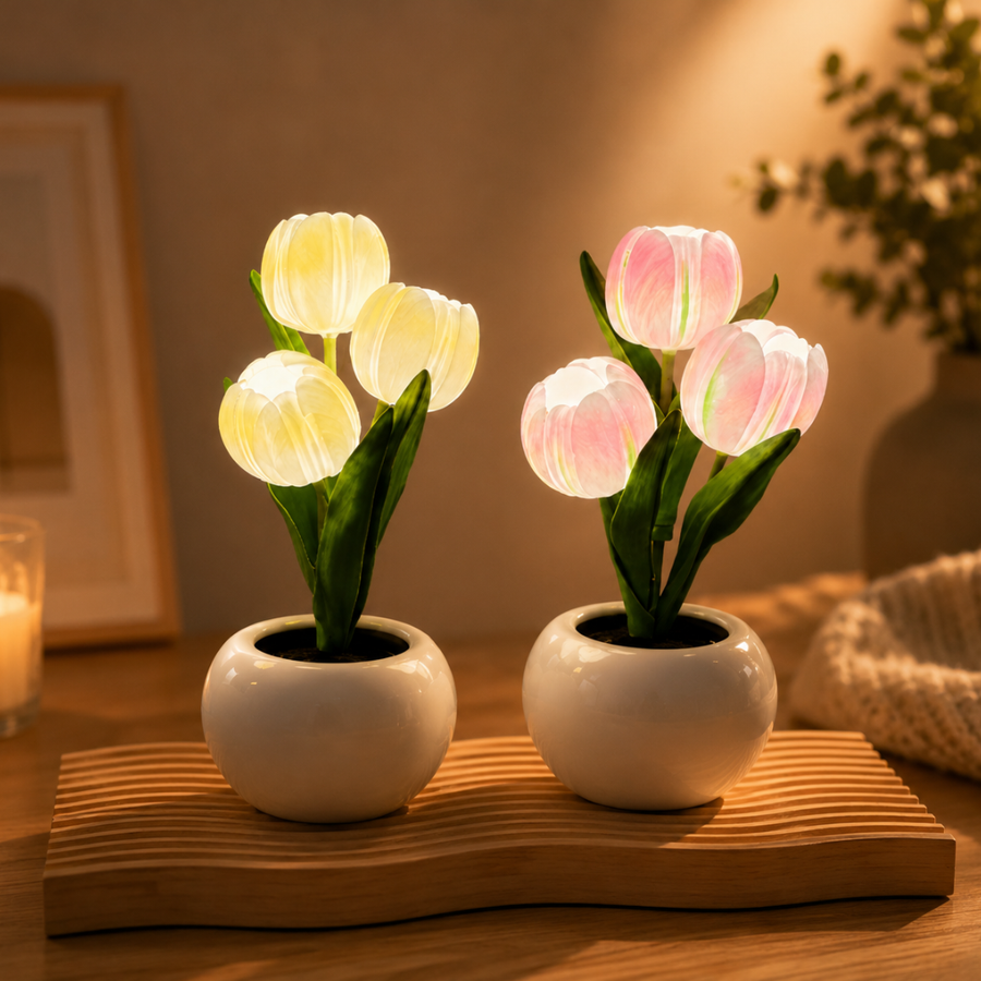 Front view of a glowing LED tulip lamp in pink