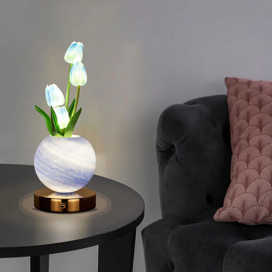 Close-up of the tulip-shaped lamp shades lit up