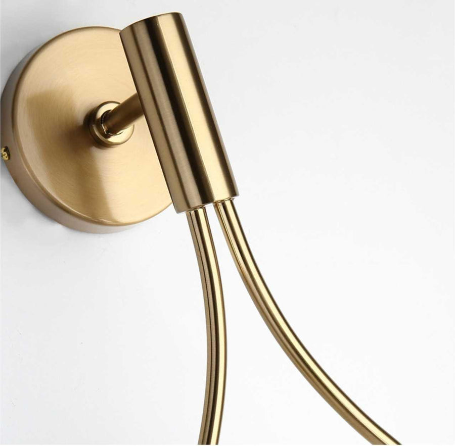 Side view showing the sconce's clean, curved silhouette.