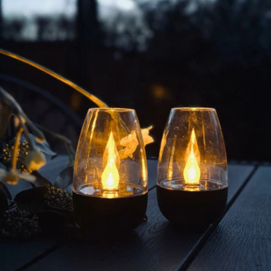Solar garden lantern placed on a balcony railing.