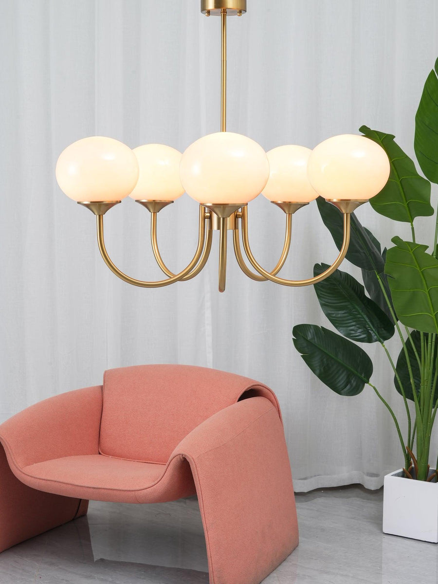 Angled view of copper and white chandelier
