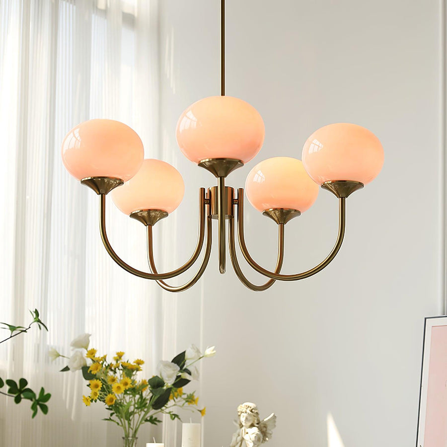 Chandelier with pink shades in a reading nook