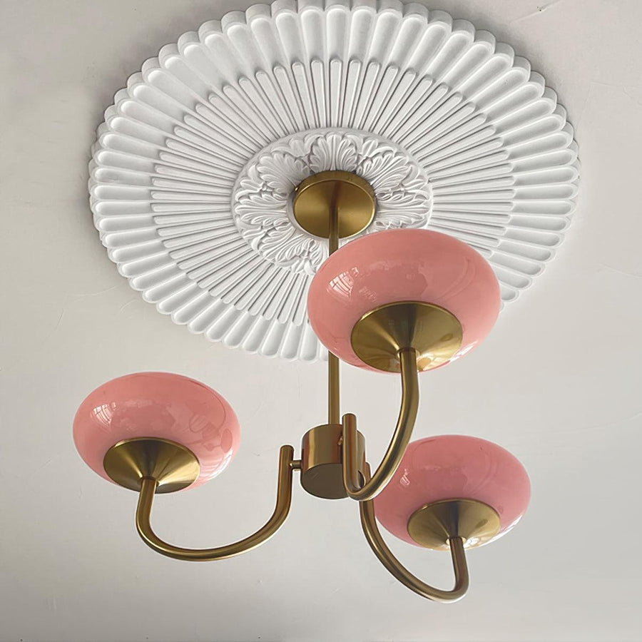 Front view of chrome and pink chandelier