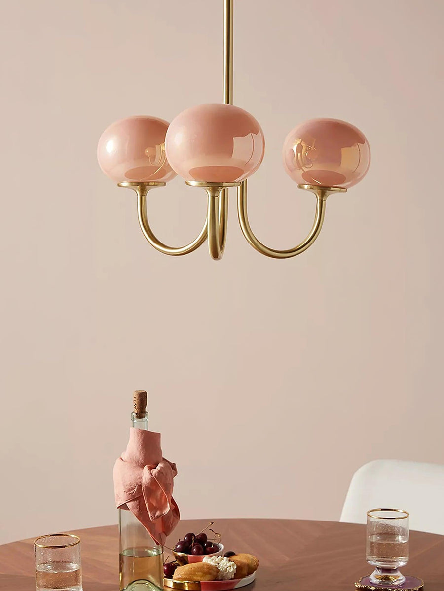 Close-up of chandelier's cream glass shades