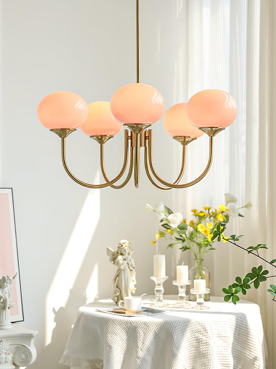 Chandelier styled above a home office desk