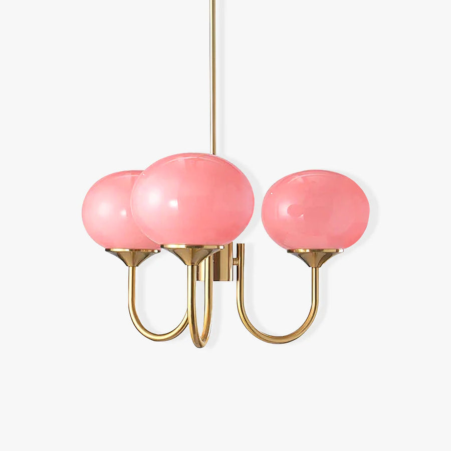 Chandelier casting warm light on a wall