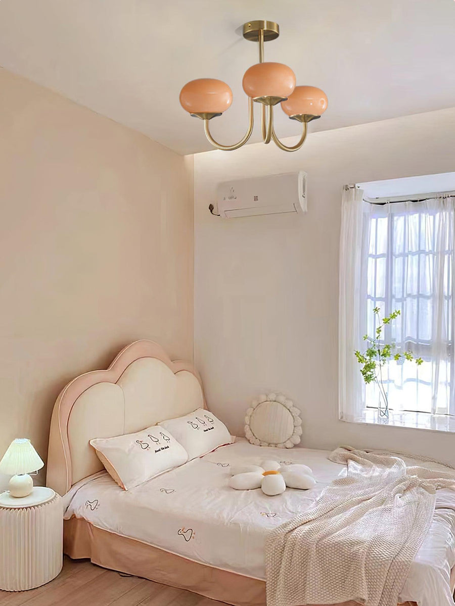 Full view of chrome chandelier with cream shades