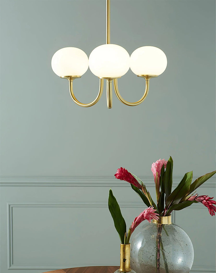 Chandelier styled in a minimalist bedroom