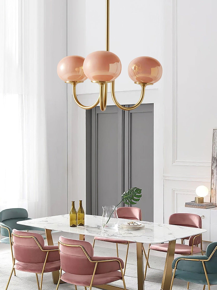 Chandelier hanging over a round dining table