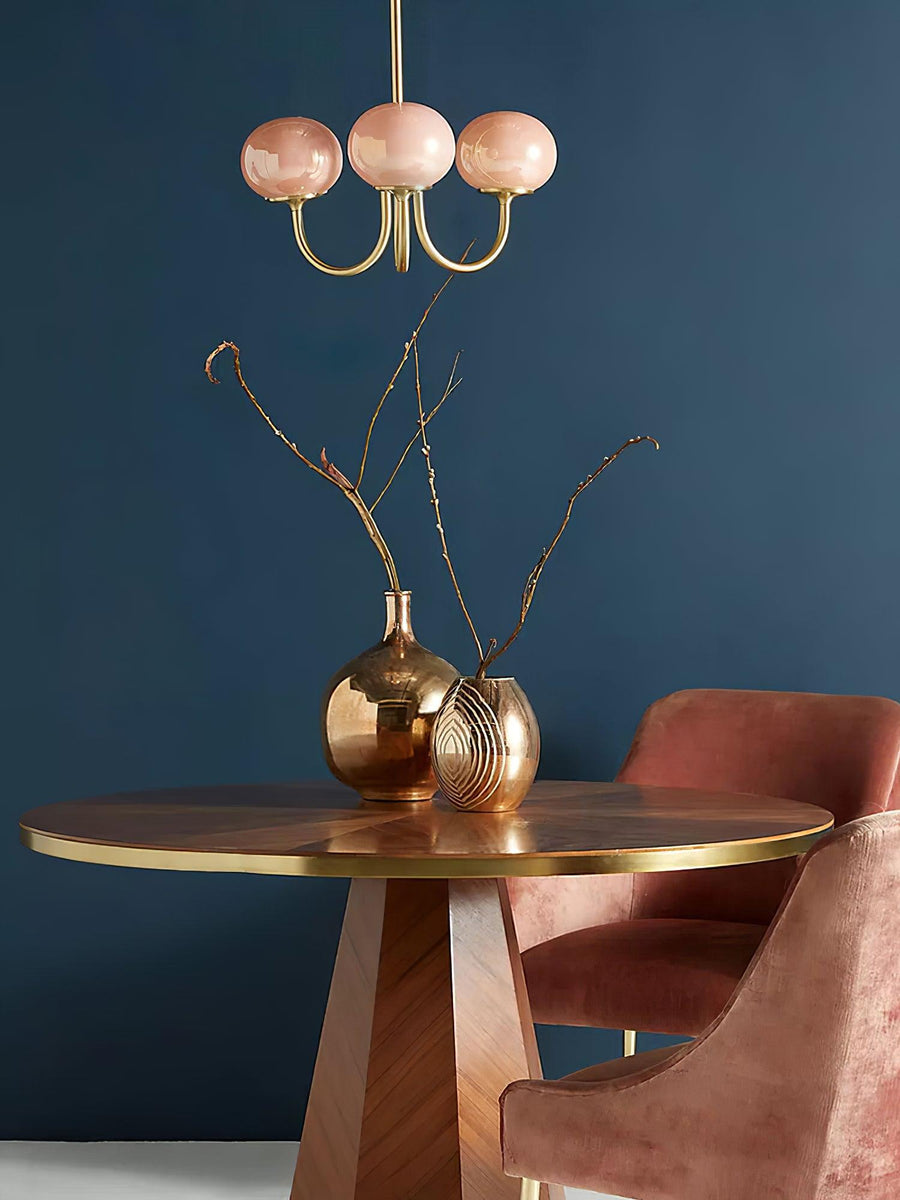 Angled view of pink and copper chandelier