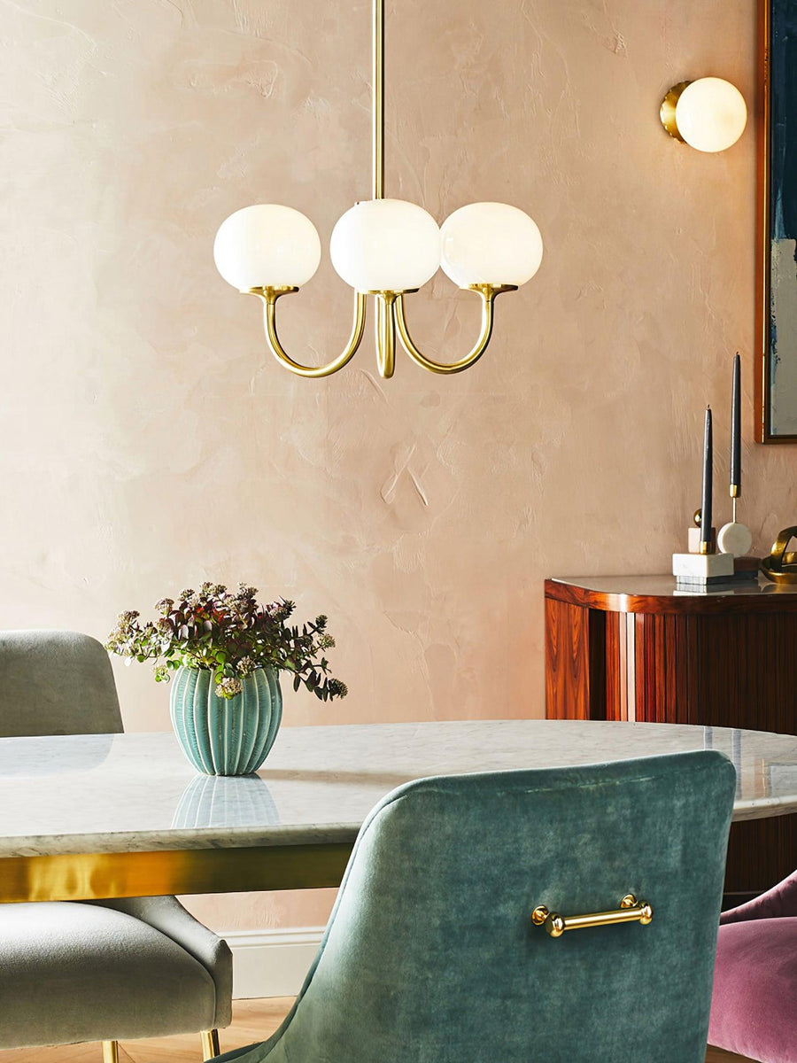 Chandelier hanging above a nightstand