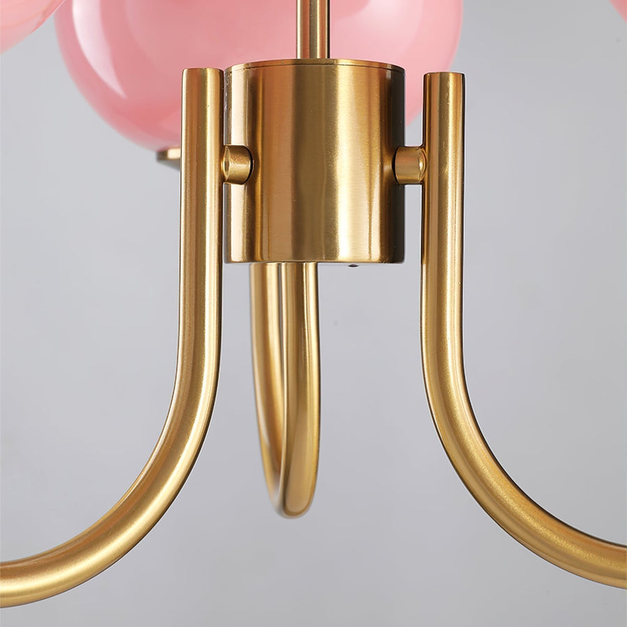 Chandelier hanging above a bed frame