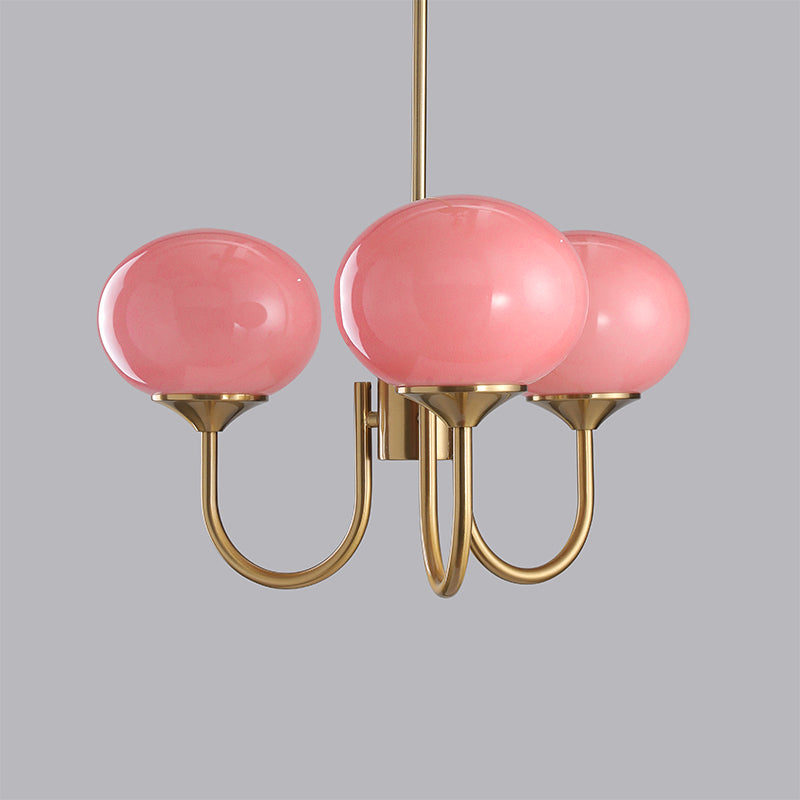 Side view of copper chandelier with white shades