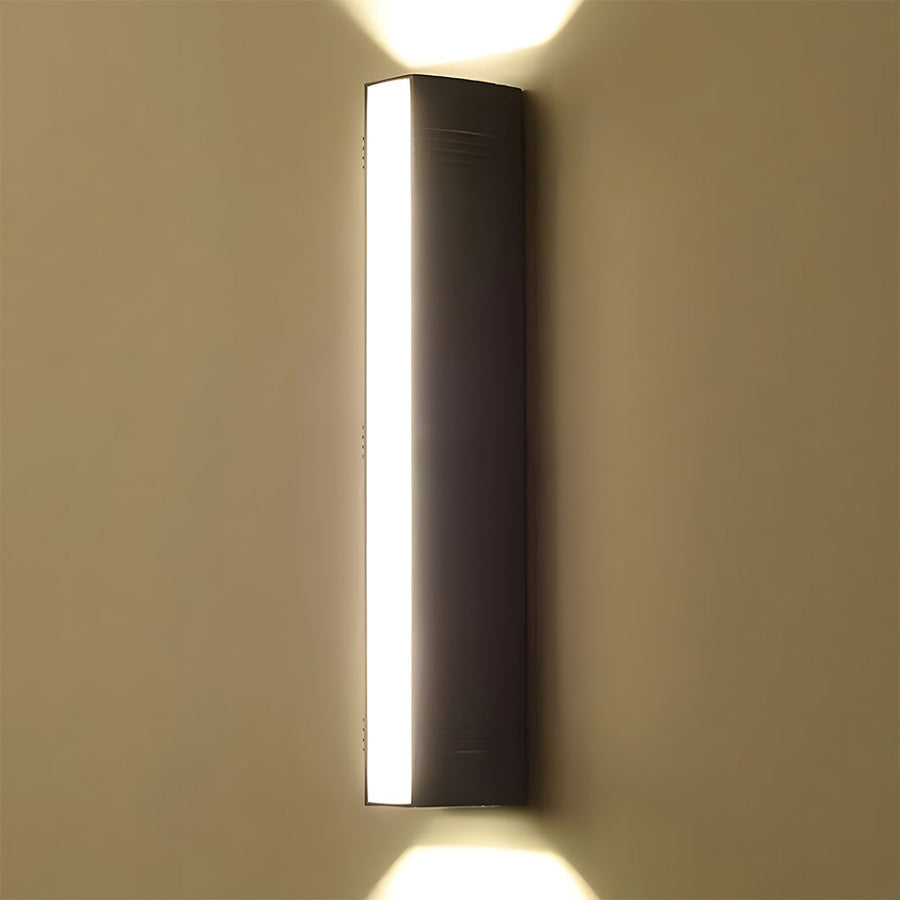 Outdoor wall light installed above an outdoor seating area