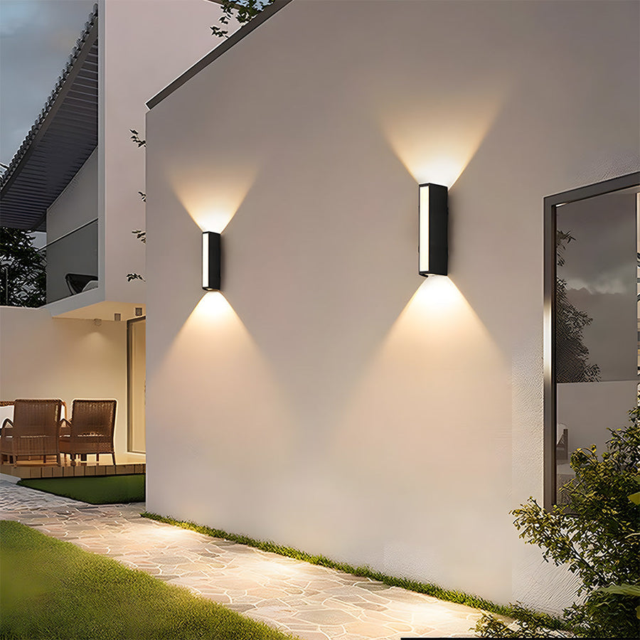 Outdoor wall light casting an upward beam of light