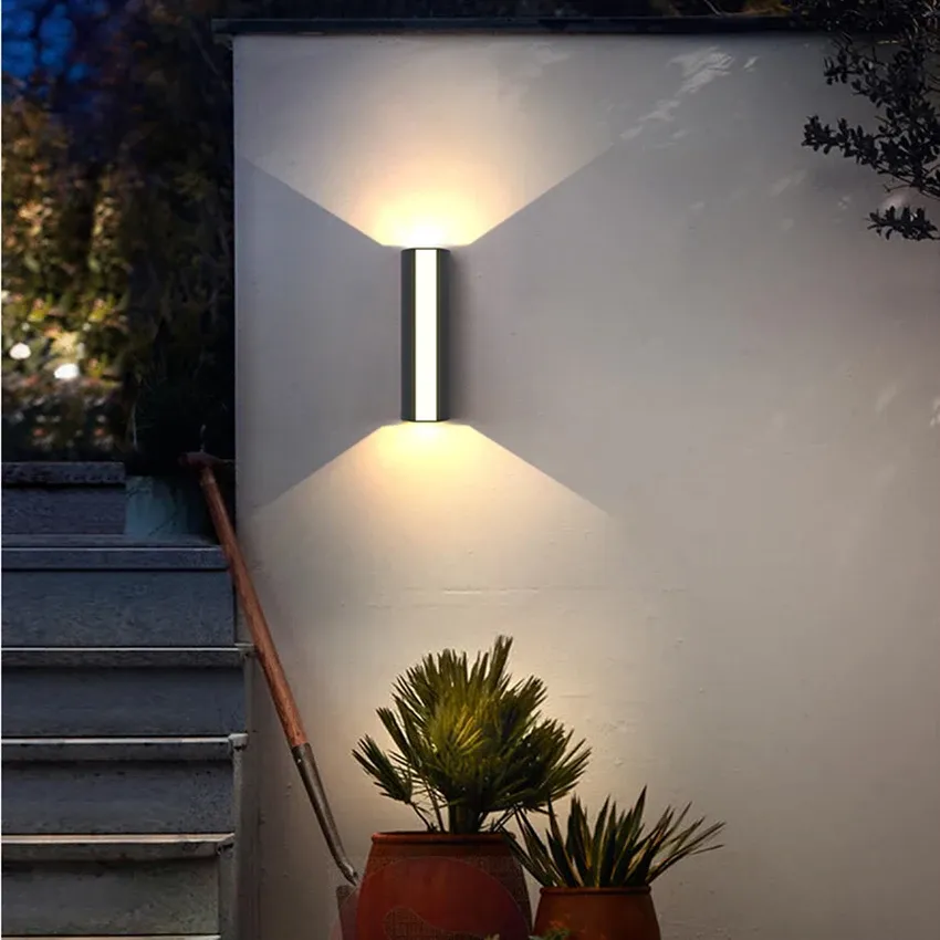 Outdoor wall light casting a downward beam of light