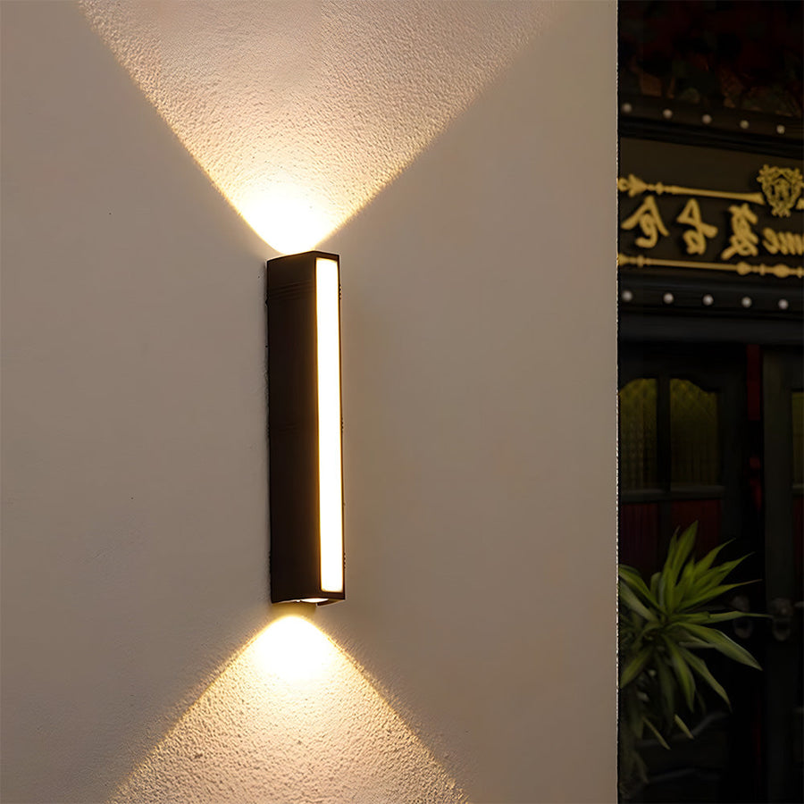 Wall light shown against a dark exterior wall