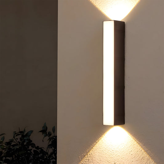 Minimalist LED outdoor wall light mounted on a brick wall