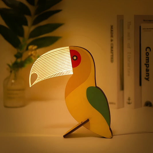 Gold minimalist table lamp glowing with warm white LED light on a nightstand