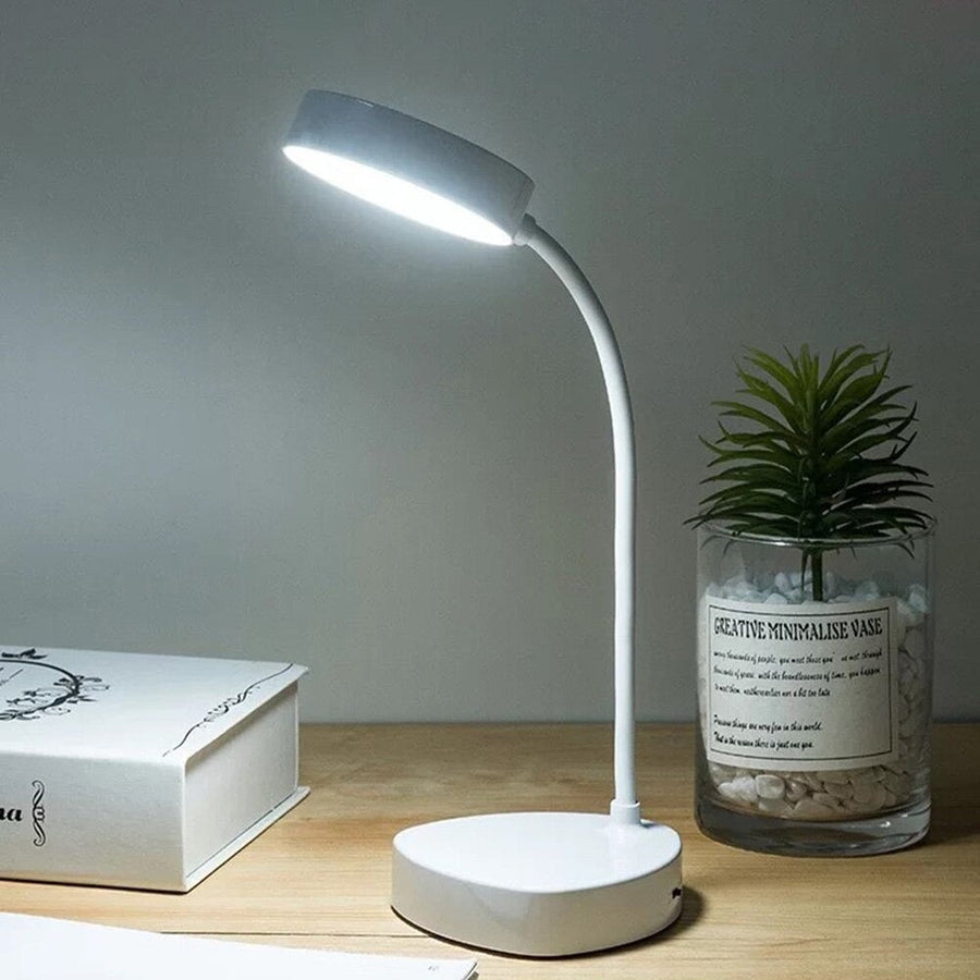 Desk lamp glowing softly on a nightstand